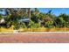 Cute yellow cottage with picket fence and brick street at 6220 5Th S Ave, St Petersburg, FL 33707