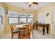 Charming breakfast nook with wooden table and chairs near kitchen at 6220 5Th S Ave, St Petersburg, FL 33707