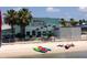 Kayaks on beach with people relaxing by Gulfport Welcome sign at 6220 5Th S Ave, St Petersburg, FL 33707