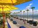 Roadside view of parked cars, beach umbrellas and Gulfport waterfront at 6220 5Th S Ave, St Petersburg, FL 33707
