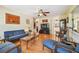 Bright living room with hardwood floors, comfy seating and a large TV at 6220 5Th S Ave, St Petersburg, FL 33707