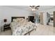 Bedroom with a queen bed, access to a patio, and a workspace at 1608 Gunsmith Dr, Lutz, FL 33559