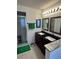 Bathroom boasts double sinks, granite counters, and a shower at 24327 Buckingham Way, Punta Gorda, FL 33980