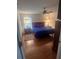 Bright bedroom with wood floors, ceiling fan, and ample space at 24327 Buckingham Way, Punta Gorda, FL 33980