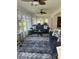 Spacious living area with lake view and comfy seating at 24327 Buckingham Way, Punta Gorda, FL 33980