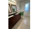 Updated bathroom with double vanity and granite countertop at 24327 Buckingham Way, Punta Gorda, FL 33980