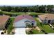 Single-story home with red tile roof, overlooking a golf course at 24327 Buckingham Way, Punta Gorda, FL 33980