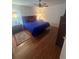 Bright bedroom with a queen-size bed and hardwood floors at 24327 Buckingham Way, Punta Gorda, FL 33980