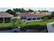 Back of house with large windows overlooking a canal at 24327 Buckingham Way, Punta Gorda, FL 33980