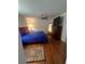 Spacious bedroom with hardwood floors and a large mirror at 24327 Buckingham Way, Punta Gorda, FL 33980