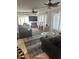 Comfortable living room with large TV and canal views at 24327 Buckingham Way, Punta Gorda, FL 33980