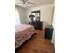 Bright bedroom with queen bed and hardwood floors at 24327 Buckingham Way, Punta Gorda, FL 33980