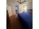Comfortable bedroom with hardwood floors and ensuite bathroom access at 24327 Buckingham Way, Punta Gorda, FL 33980