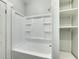 Bathroom with shower/tub combo and built-in shelving at 907 E North Bay St, Tampa, FL 33603