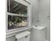 Bathroom with vanity, toilet and window at 907 E North Bay St, Tampa, FL 33603