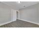 Simple bedroom with grey walls and wood-look flooring at 907 E North Bay St, Tampa, FL 33603