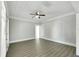 Bright bedroom with hardwood floors and ceiling fan at 907 E North Bay St, Tampa, FL 33603
