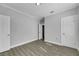 Spacious bedroom with grey walls, wood-look flooring, and a closet at 907 E North Bay St, Tampa, FL 33603