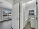 Bright bedroom with hardwood floors and access to bathroom at 907 E North Bay St, Tampa, FL 33603