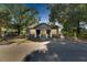Gray house with a front porch, white columns, and a fenced yard at 907 E North Bay St, Tampa, FL 33603