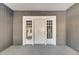 White front door with glass panels, welcoming entryway at 907 E North Bay St, Tampa, FL 33603