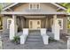 Quaint front porch with white columns and wooden flooring at 907 E North Bay St, Tampa, FL 33603