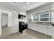 Updated kitchen with white cabinets, granite countertops, and stainless steel appliances at 907 E North Bay St, Tampa, FL 33603