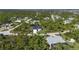 Aerial view of a house and surrounding neighborhood at 10110 Bay State Dr, Port Charlotte, FL 33981