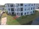 Condo building's side, highlighting private patio access at 3127 W Sligh Ave # 103B, Tampa, FL 33614