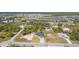 A neighborhood with waterways, roads and scattered homesites; the natural landscape is captured from above at 14346 San Domingo Blvd, Port Charlotte, FL 33981