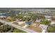 Neighborhood aerial view showing proximity to lakes, with a view of scattered single-Gathering homes at 14346 San Domingo Blvd, Port Charlotte, FL 33981