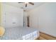 Bright bedroom features a double door closet, ensuite and wood-look floors at 14346 San Domingo Blvd, Port Charlotte, FL 33981