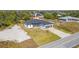 Well-maintained single-Gathering home featuring a two-car garage and a beautifully landscaped front yard at 14346 San Domingo Blvd, Port Charlotte, FL 33981