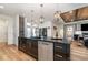 Stunning kitchen features black cabinets, elegant gold hardware, and a sleek black marble countertop at 14346 San Domingo Blvd, Port Charlotte, FL 33981