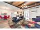 Bright and airy living room showcasing modern décor, wood flooring, and seamless flow into the dining area at 14346 San Domingo Blvd, Port Charlotte, FL 33981