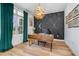 Bright home office featuring wood floors, modern lighting, and built in cabinetry at 14346 San Domingo Blvd, Port Charlotte, FL 33981