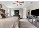 Tastefully decorated bedroom featuring a unique green wall accent with neon lighting and a spacious layout at 32924 Estate Garden Dr, Wesley Chapel, FL 33545