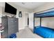Bedroom with a bunk bed, dresser, and carpeted floors at 32924 Estate Garden Dr, Wesley Chapel, FL 33545