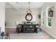 Contemporary dining room featuring a wooden table and upholstered chairs at 32924 Estate Garden Dr, Wesley Chapel, FL 33545