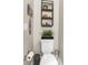 Half bathroom with toilet, toilet paper holder, wall decorations and trash can at 32924 Estate Garden Dr, Wesley Chapel, FL 33545