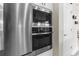 Modern stainless steel appliances built into white cabinetry at 32924 Estate Garden Dr, Wesley Chapel, FL 33545