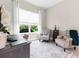 Bright office with window views, desk, and seating area, perfect for working from home at 32924 Estate Garden Dr, Wesley Chapel, FL 33545
