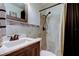 Updated bathroom featuring a vanity and tiled shower at 5820 43Rd N Ter # 1406, St Petersburg, FL 33709