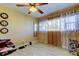 Cozy bedroom with a ceiling fan, light toned walls, and an ample source of natural light at 5820 43Rd N Ter # 1406, St Petersburg, FL 33709