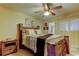 Comfortable bedroom featuring wood furniture and a ceiling fan at 5820 43Rd N Ter # 1406, St Petersburg, FL 33709