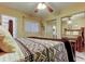 Comfortable bedroom featuring a ceiling fan and mirrored closet doors at 5820 43Rd N Ter # 1406, St Petersburg, FL 33709