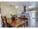 Dining room featuring wood table and easy access to the kitchen and the entry at 5820 43Rd N Ter # 1406, St Petersburg, FL 33709