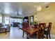Bright dining room with wood table, pendant lighting, and open access to the living room at 5820 43Rd N Ter # 1406, St Petersburg, FL 33709