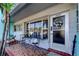 Inviting covered front porch with seating and decorative touches enhance the entryway at 5820 43Rd N Ter # 1406, St Petersburg, FL 33709