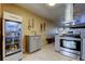 Stylish kitchen showcasing stainless steel oven and stove with granite countertops and a refrigerator at 5820 43Rd N Ter # 1406, St Petersburg, FL 33709